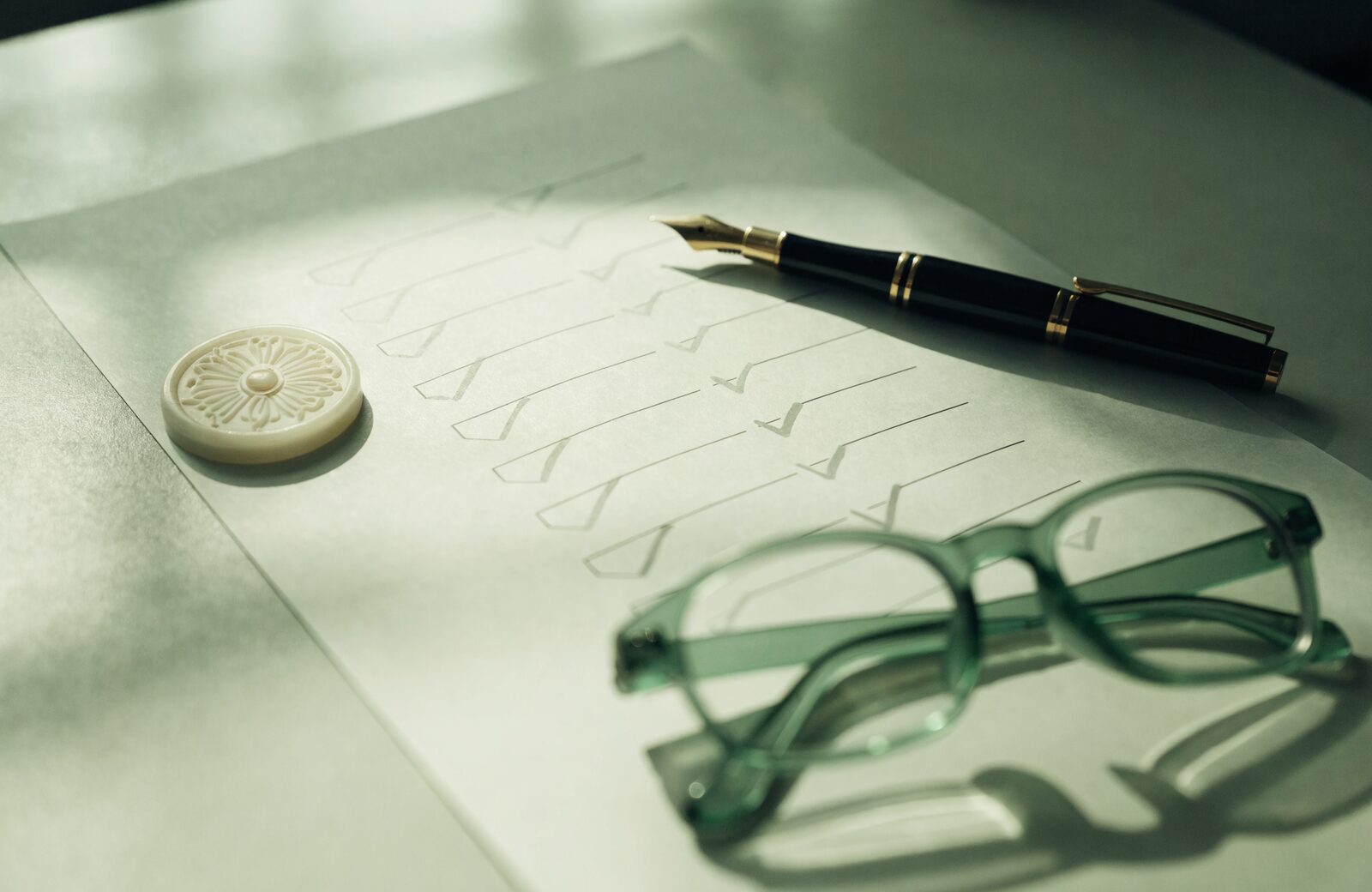 A compliance checklist, fountain pen, and wax seal on a desk, representing LegitScript certification review